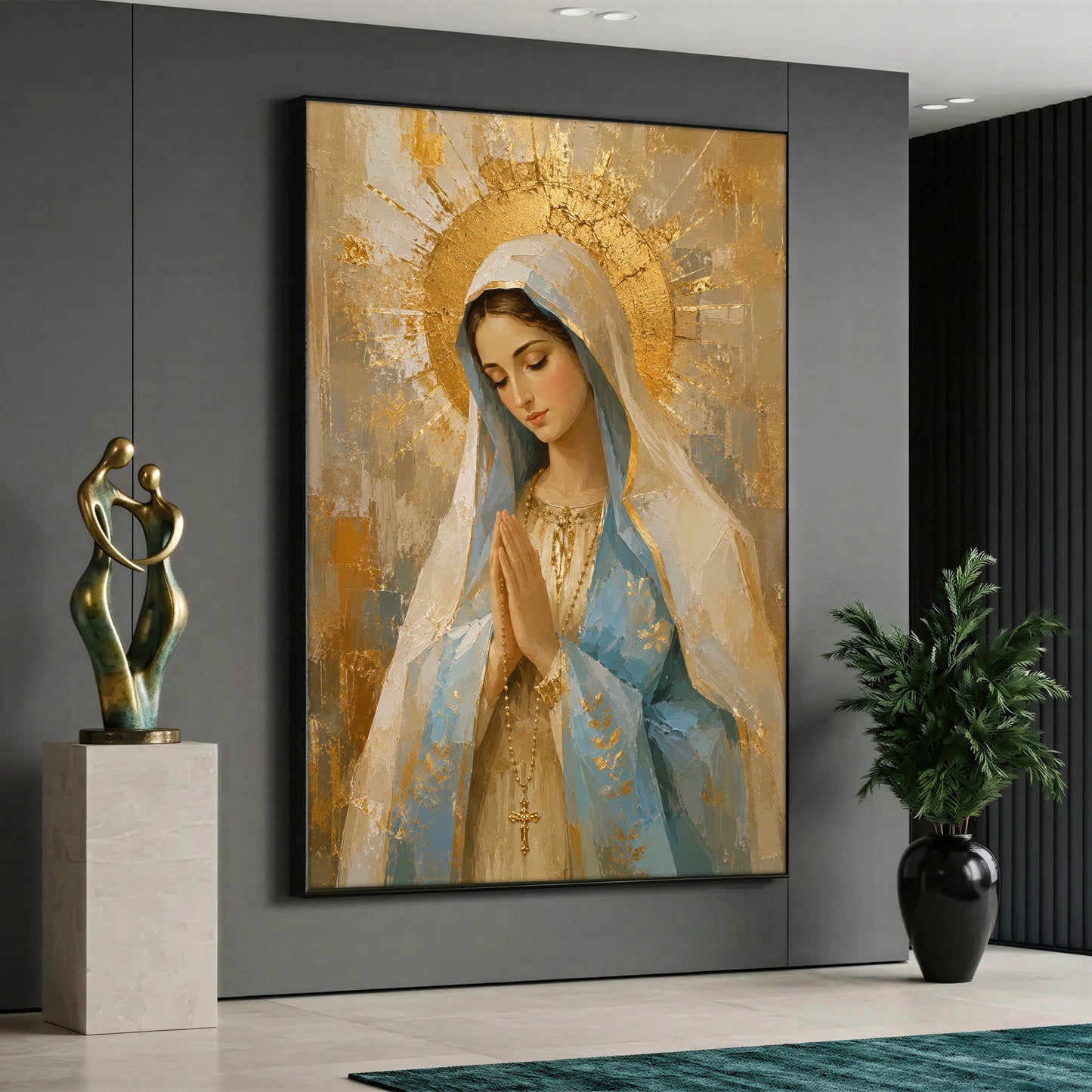 A vertical canvas art of the Virgin Mary praying with a golden halo and rosary, displayed on a grey wall in a modern living room setting.