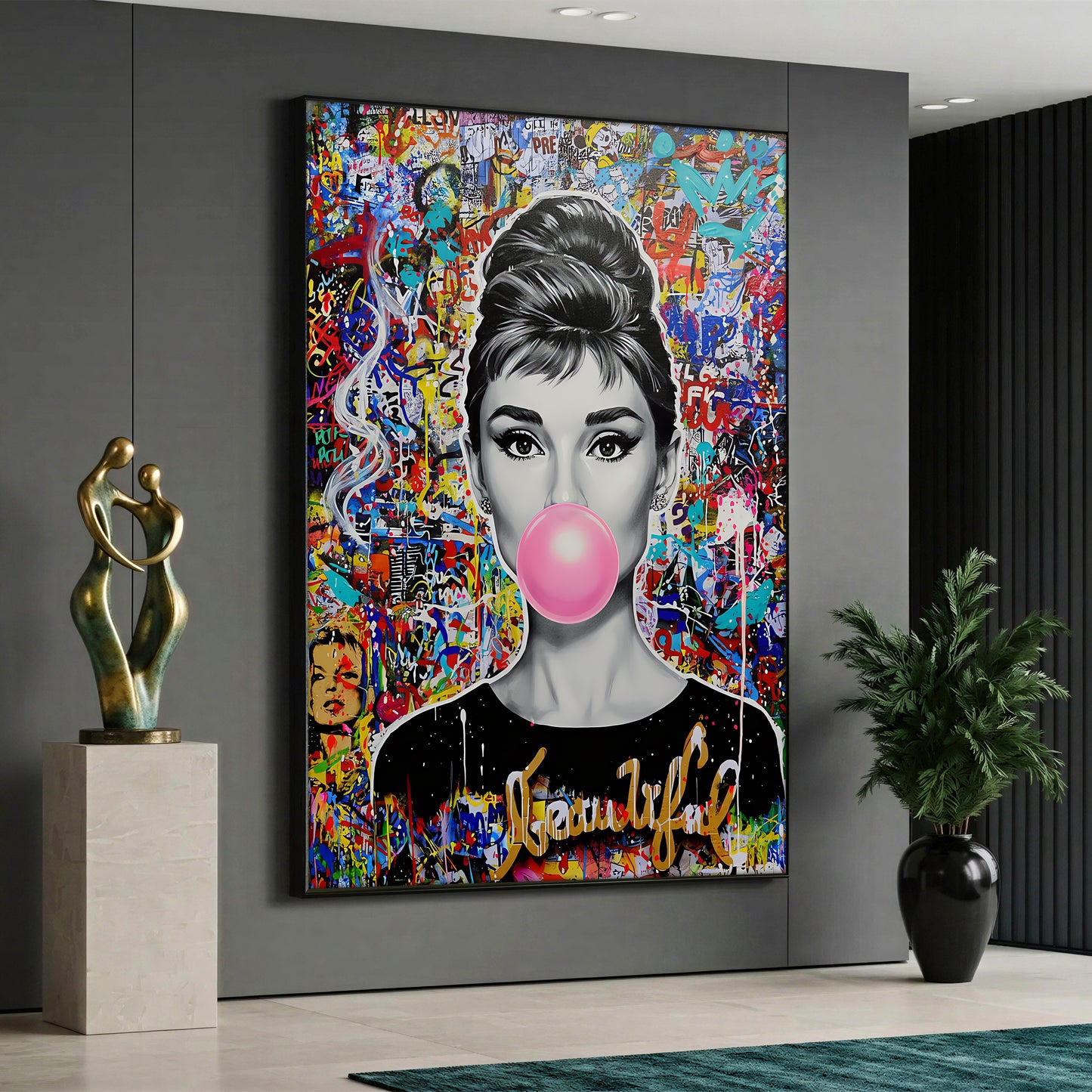 A pop art style canvas painting depicting a black and white portrait of Audrey Hepburn blowing a pink bubble gum against a vibrant, multicolored graffiti and street art background.