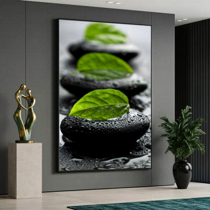A serene spa canvas painting depicting a row of smooth black pebbles covered in water droplets, each topped with a vibrant green leaf in a close-up macro view.