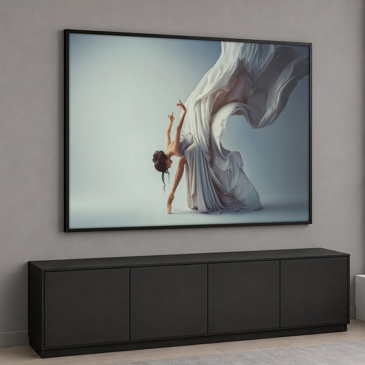 A graceful female ballerina dancing on pointes with a large, flowing dramatic white fabric behind her against a light gray background.