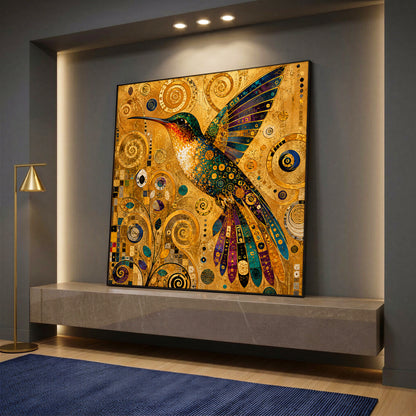 A square canvas wall art featuring a colorful hummingbird designed in a golden Klimt-inspired mosaic style, resting on a stone shelf.